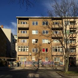 Residential buildings in city against sky