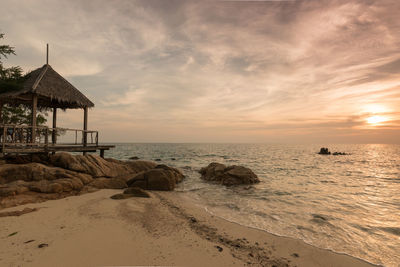 Scenic view of sea against sky at sunset