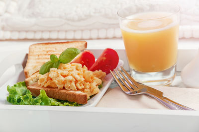 Breakfast in tray on bed 