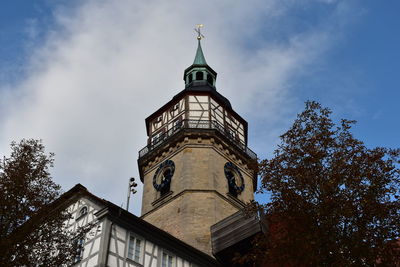 Low angle view of clock tower against sky