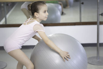 Young woman exercising in gym