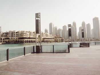 View of buildings in city against clear sky