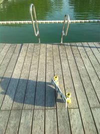 High angle view of skateboard on jetty