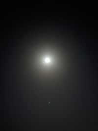 Low angle view of moon in sky at night