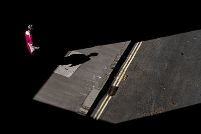 High angle view of woman standing on street