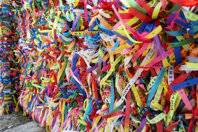 Thousands of colored ribbons tied to a gate. salvador, bahia, brazil.