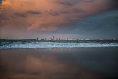 Scenic view of sea against cloudy sky