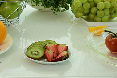 High angle view of fruits in plate on table