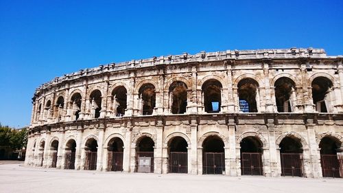 Low angle view of historical building against blue sky