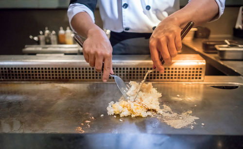 Close-up of man preparing food