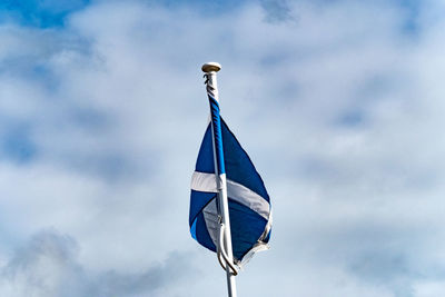 Low angle view of flag against sky