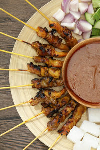 High angle view of meat on barbecue grill