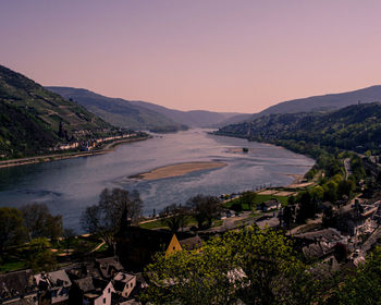 High angle view of river amidst mountains against clear sky