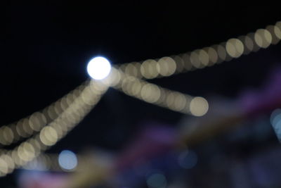 Defocused image of illuminated lights at night