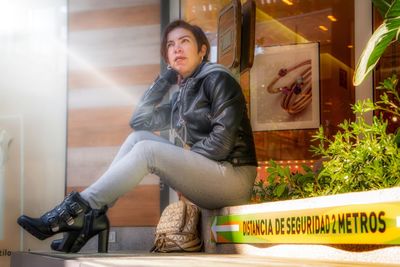 Portrait of young man sitting at home