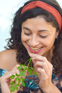 Close-up portrait of a smiling young woman
