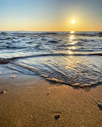 Scenic view of beach during sunset