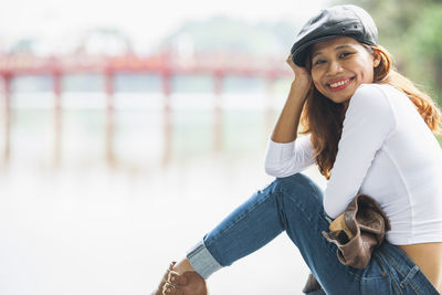 Beautiful woman relaxing at hoan kiem lake in hanoi / vietnam