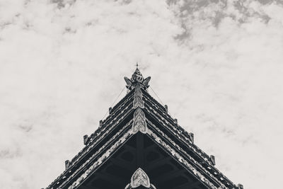 Low angle view of temple building against cloudy sky