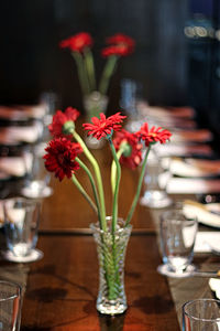 Flower vase on table in restaurant