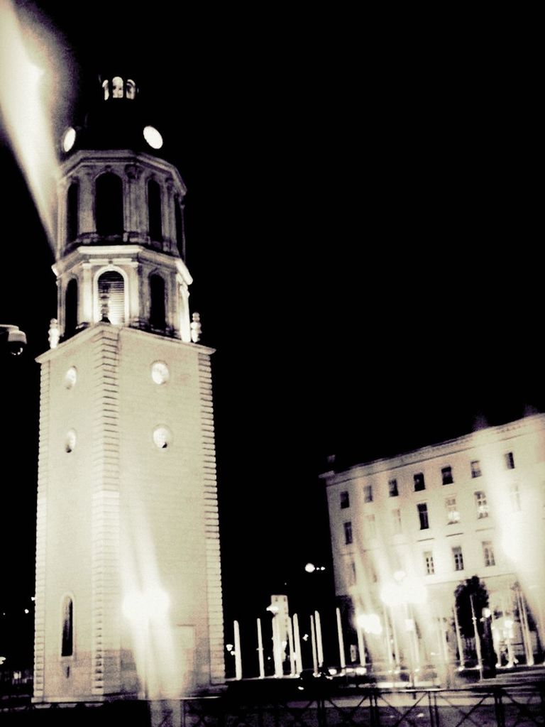 architecture, building exterior, built structure, low angle view, night, illuminated, church, building, religion, clear sky, city, sky, outdoors, arch, tower, no people, history, facade, street light