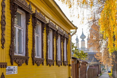 Low angle view of yellow building against sky