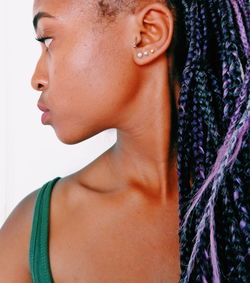 Close-up of young woman with dreadlocks