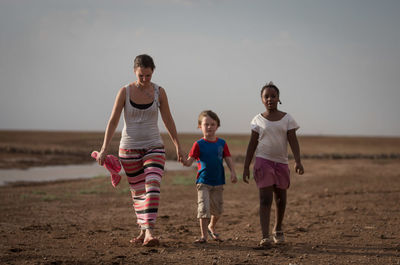 Little girl playing with arms raised