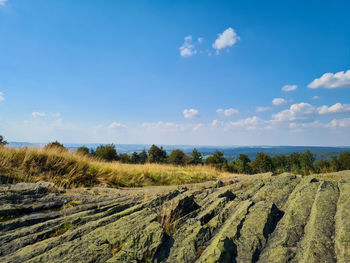 Scenic view of rock formation and landscape against sky