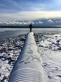 Scenic view of sea against cloudy sky