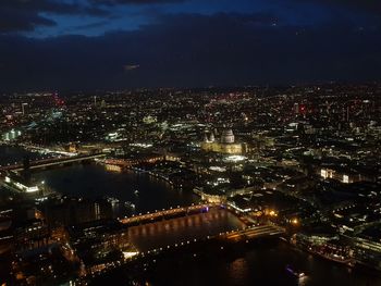 High angle view of illuminated buildings in city at night