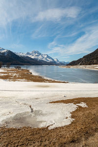 Switzerland, february 21, 2023 panorama with the lake of silvaplana and the mount corvatsch 
