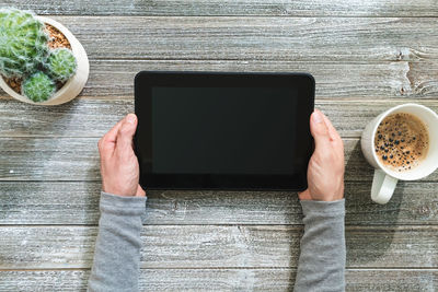 Directly above view of man using laptop on table