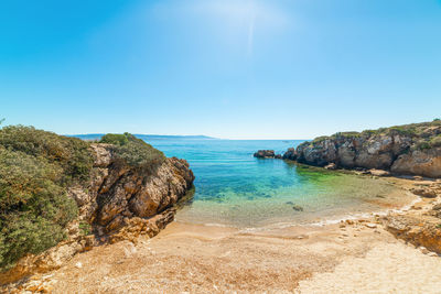 Scenic view of sea against clear blue sky