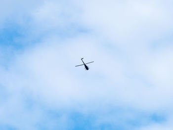 Low angle view of airplane flying in sky