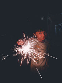 View of firework display at night