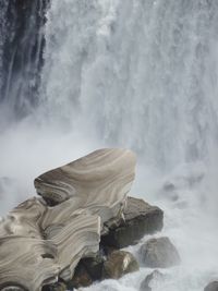 Scenic view of waterfall and ice