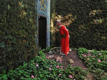 Man standing at entrance in forest