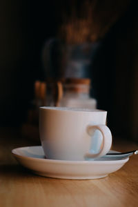 Close-up of coffee cup on table