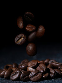 Close-up of coffee beans on table