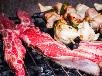 High angle view of meat on barbecue grill