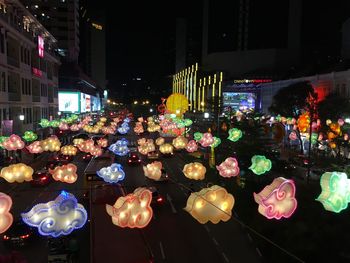 Illuminated lanterns in city at night