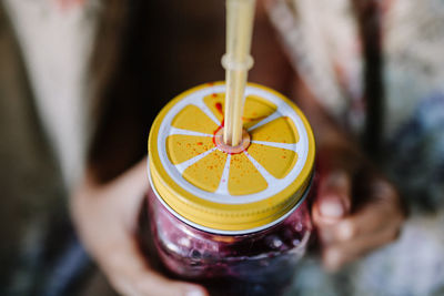 Close-up of hand holding drink