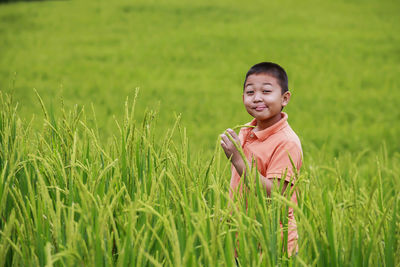Portrait of smiling girl on field