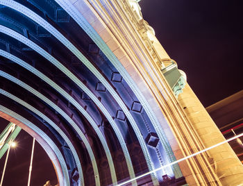 Low angle view of illuminated building at night