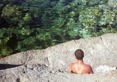 Woman standing on rocks