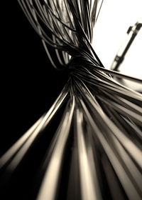 Close-up of metallic structure against black background
