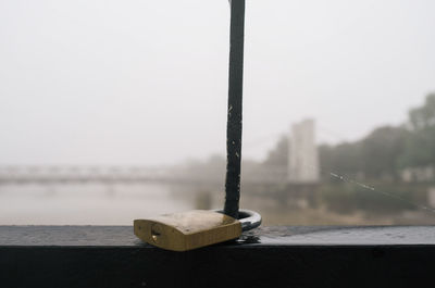 Close-up of boat on sea against sky