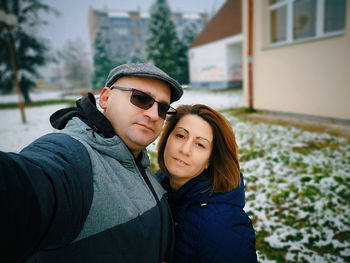 Portrait of couple standing during winter