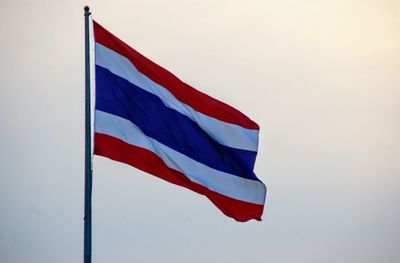 Low angle view of flag against sky